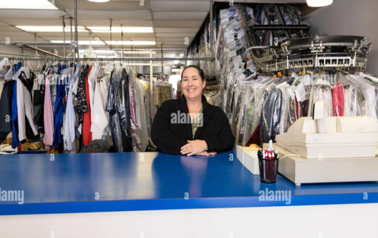 Owner of Model Quality Cleaner at the front counter